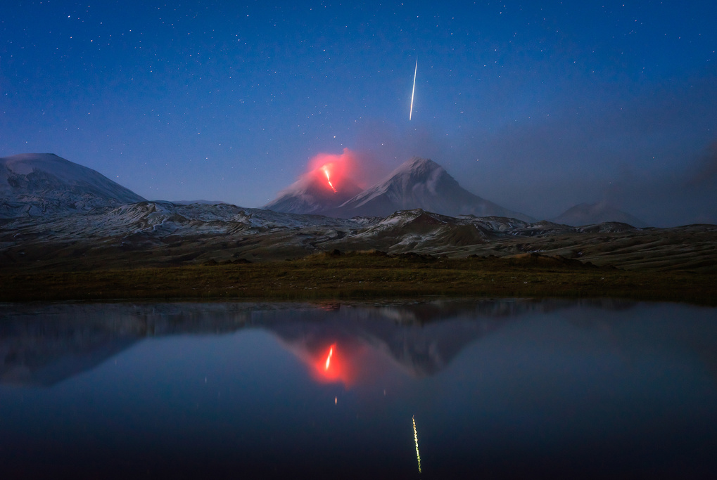 erupting_volcano_magic_meteor_reflection_-_tomas_vdw